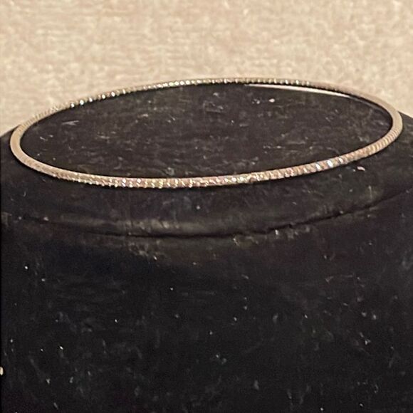 7.5” stackable polished silver tone bangle bracelet w/32 prong set crystals - Picture 2 of 12